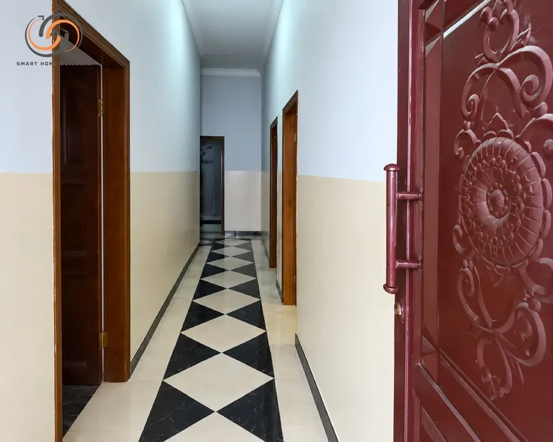 Carved entrance door and hallway